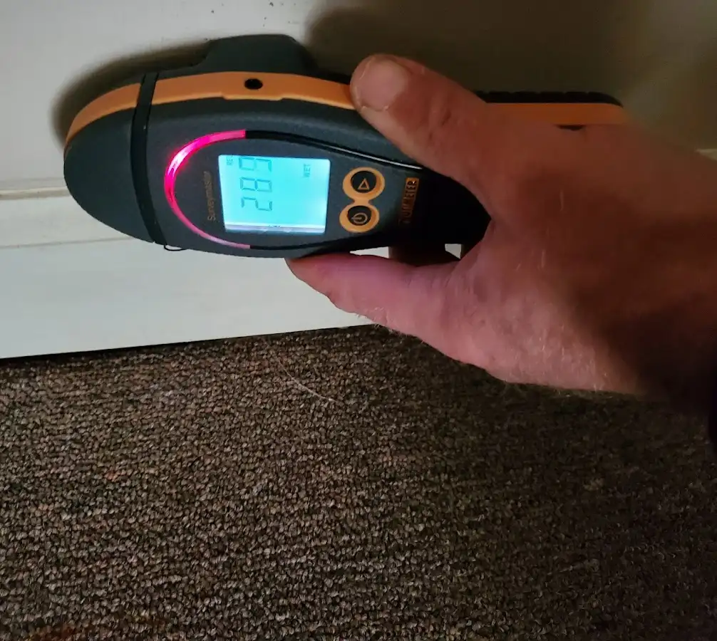 Moisture detection at baseboard during Storm Damage Restoration in Mount Pleasant